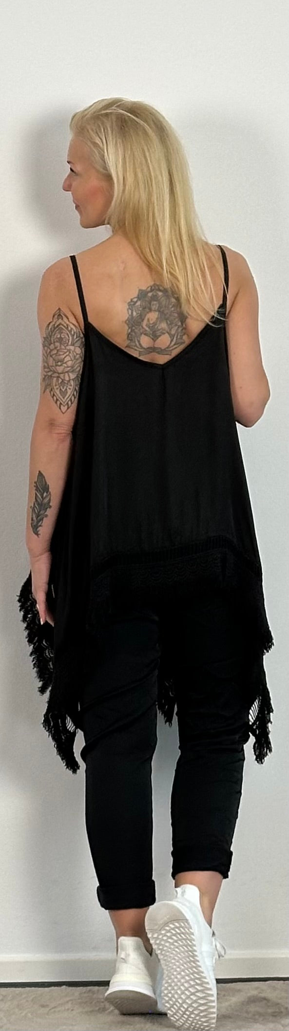 Shiny long top with crochet cuffs and fringes "Malu" - black