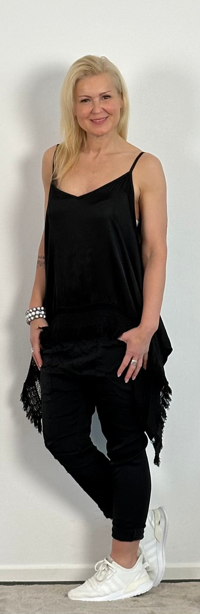 Shiny long top with crochet cuffs and fringes "Malu" - black