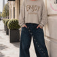 Sweater mit Linksnähten und Print - beige
